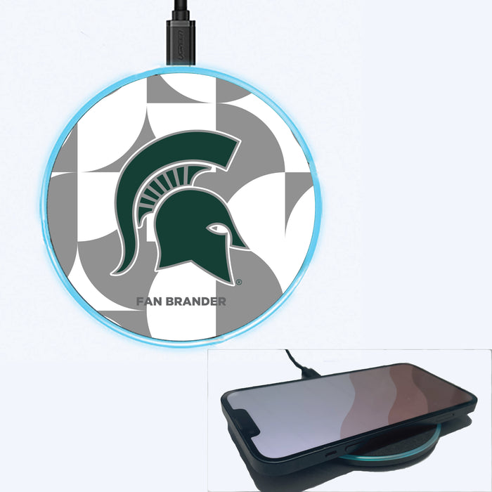 Fan Brander Grey 15W Wireless Charger with Michigan State Spartans Primary Logo on Geometric Circle Background