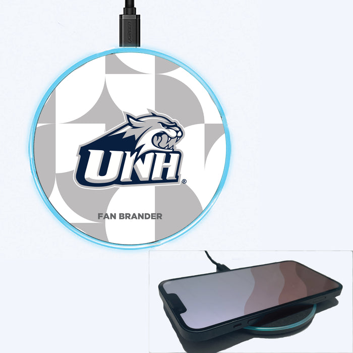 Fan Brander Grey 15W Wireless Charger with New Hampshire Wildcats Primary Logo on Geometric Circle Background
