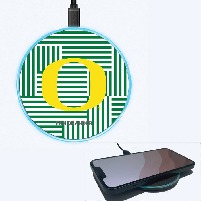 Fan Brander Grey 15W Wireless Charger with Oregon Ducks Primary Logo on Geometric Lines Background